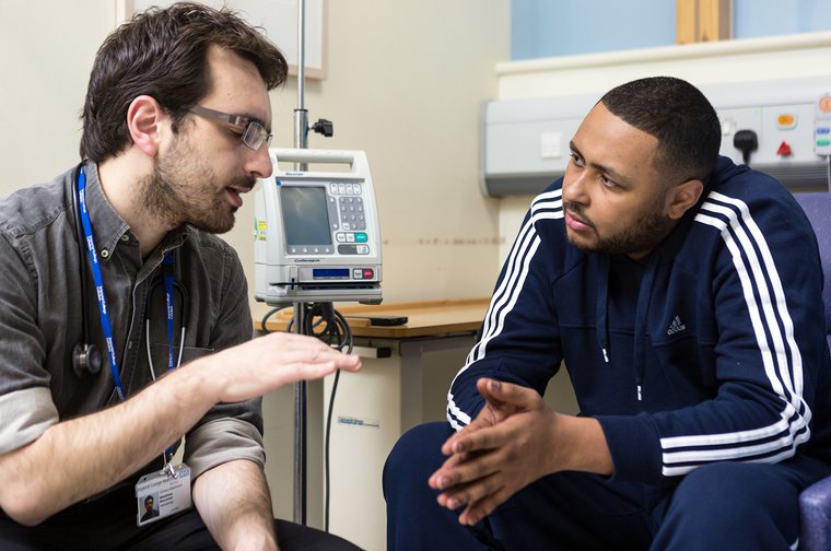 Doctor talks to a patient with leukaemia